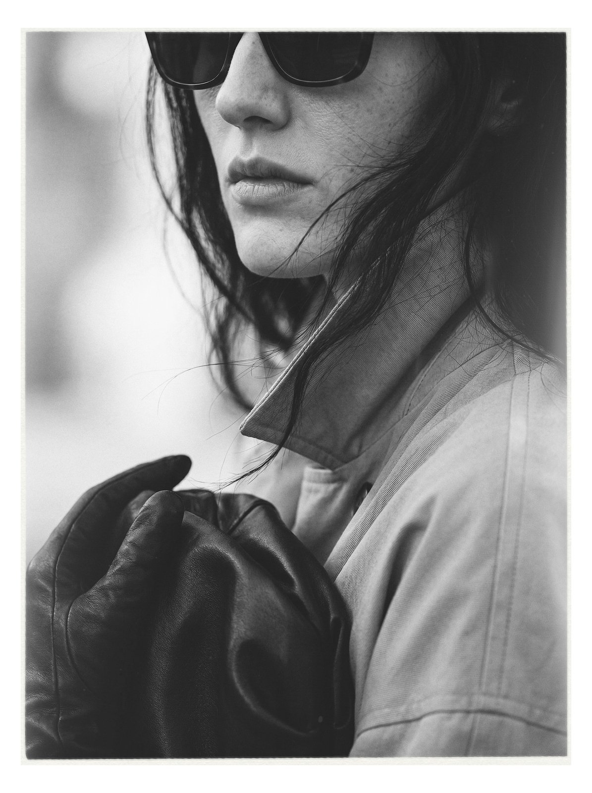 Street editorial: close portrait with a leather glove